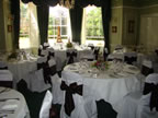 White Chair Covers and Chocolate Taffeta Sash